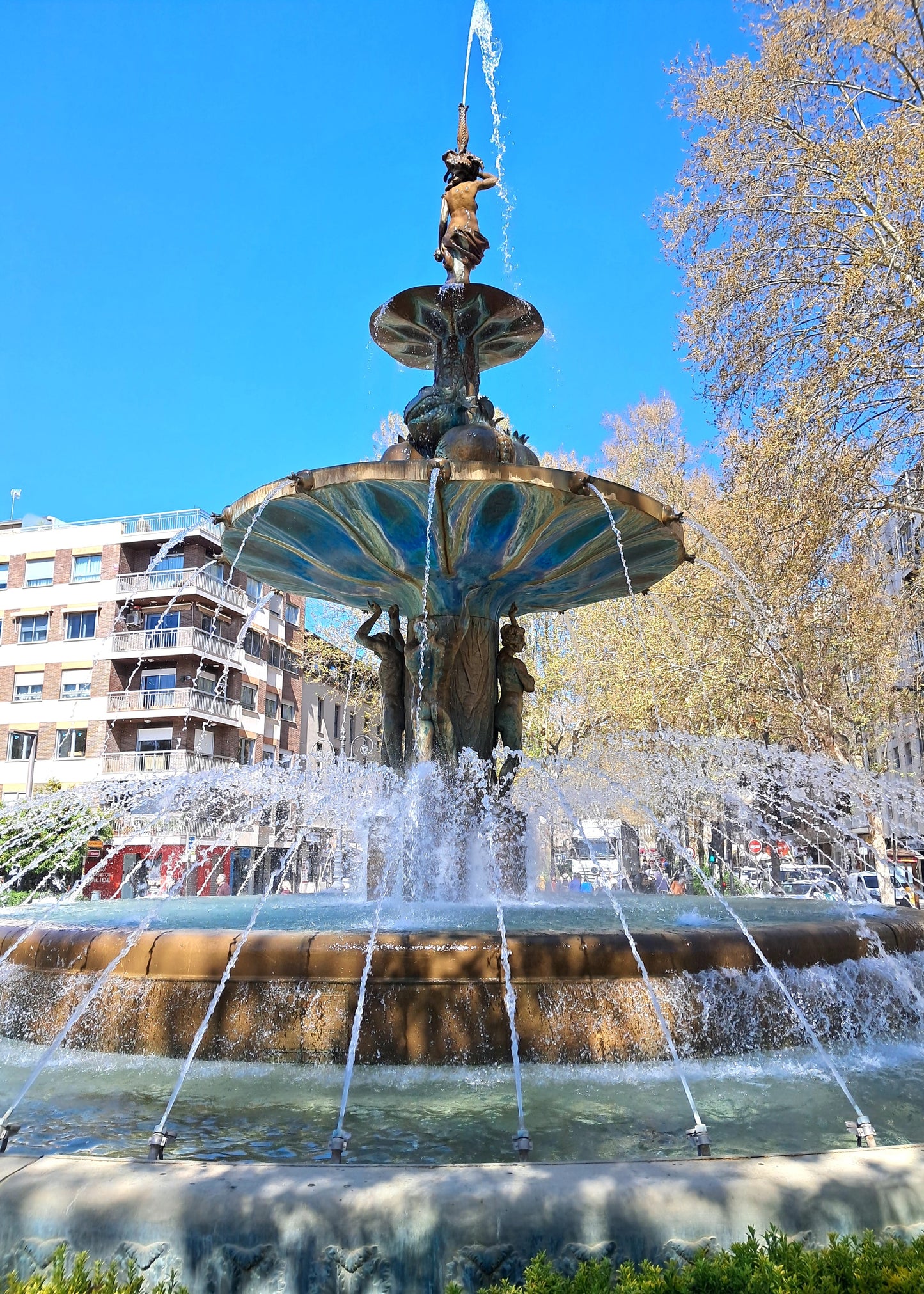 Fountain with water spouting in an urban setting