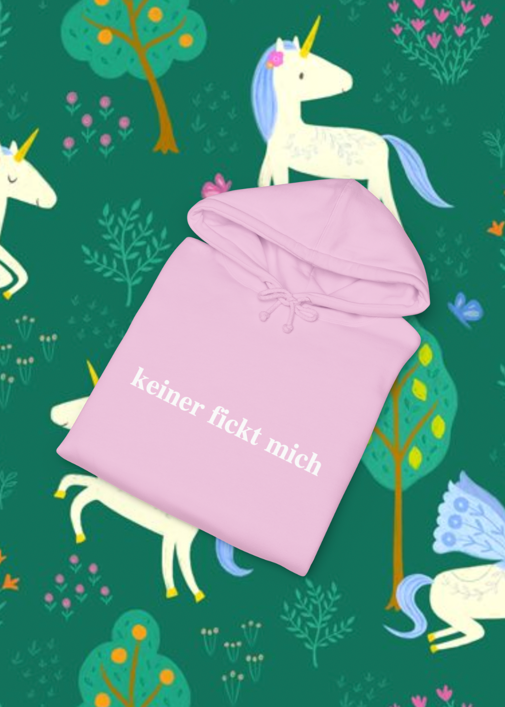 Pink hoodie with text on a green background with unicorns and trees