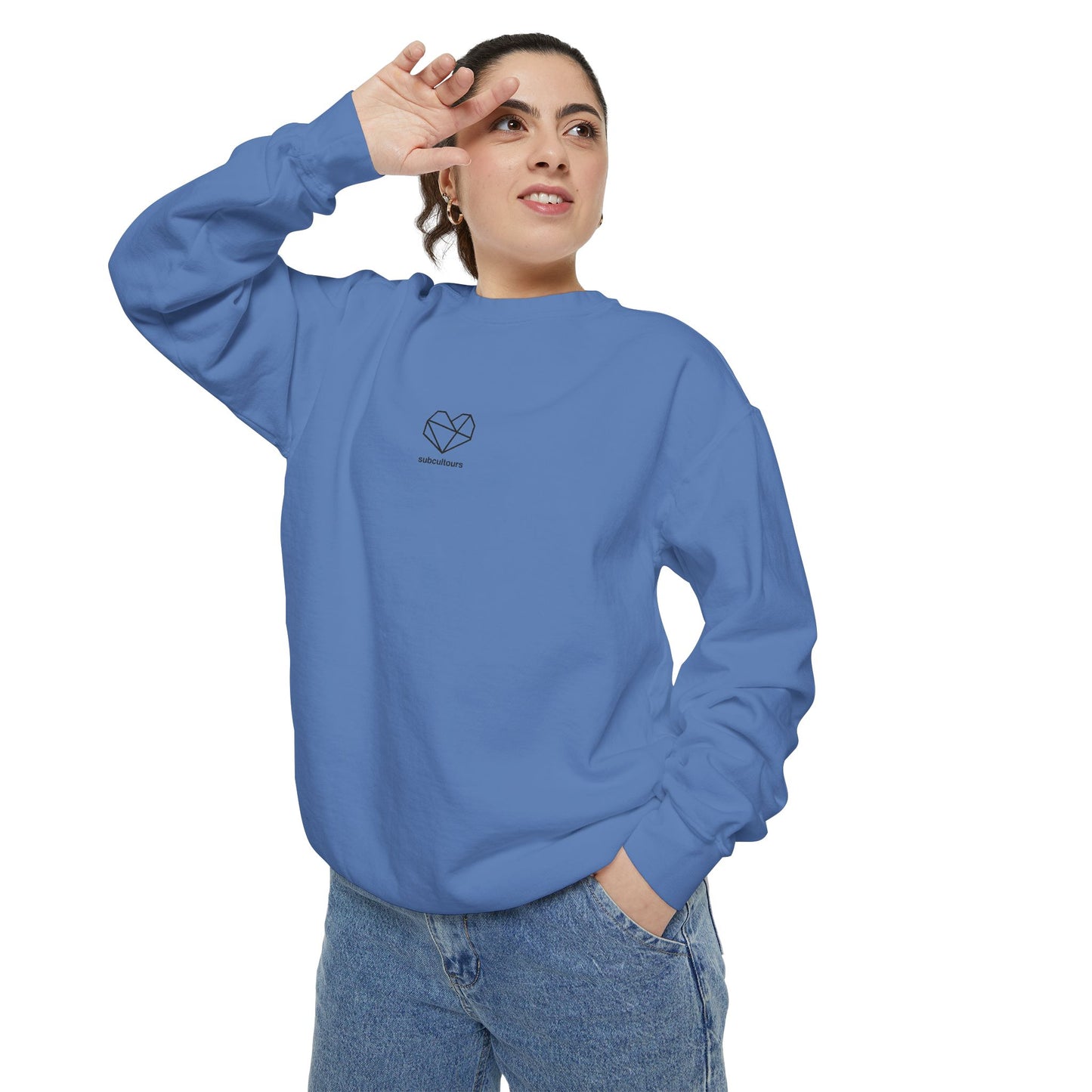 Person wearing a blue sweatshirt with a heart design on a white background