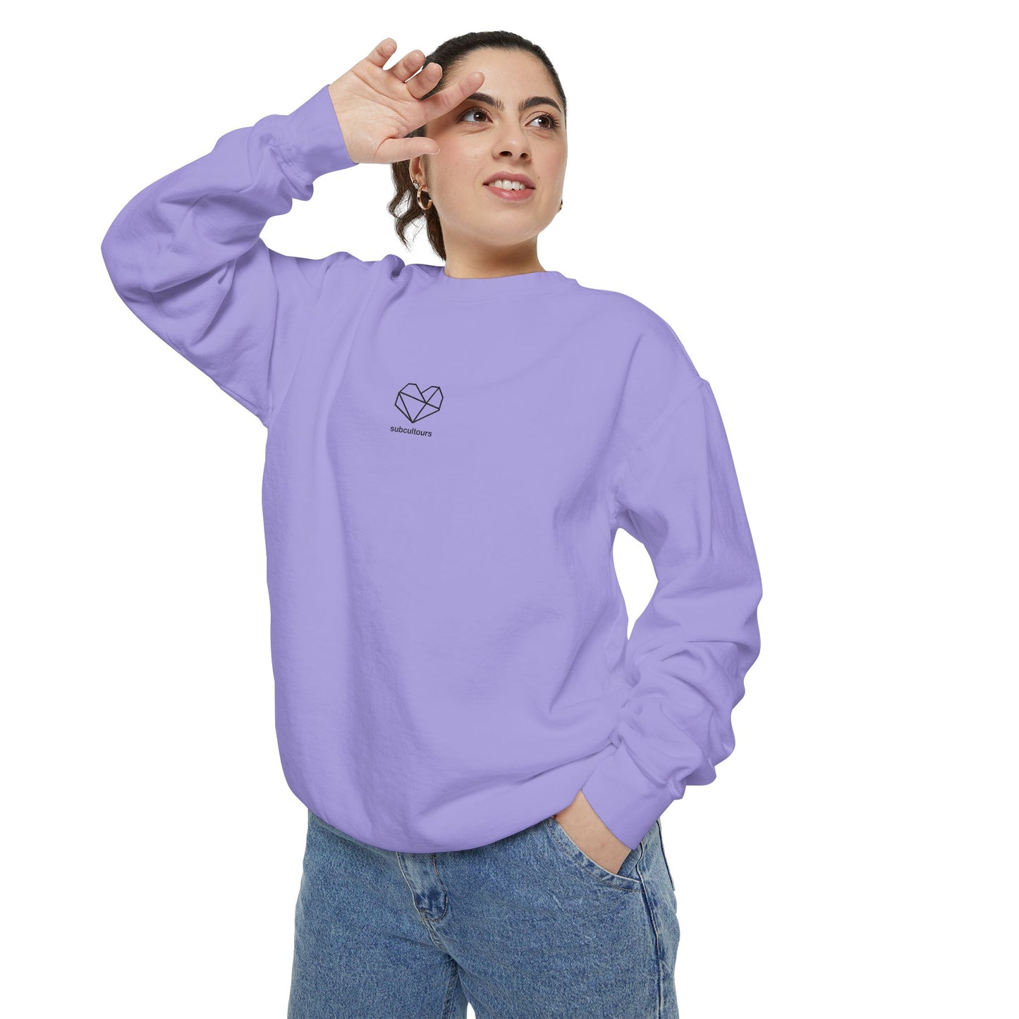Person wearing a purple sweatshirt with a heart design on a white background