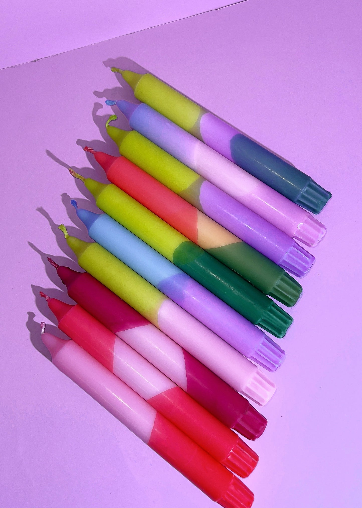 Set of colorful markers on a purple background