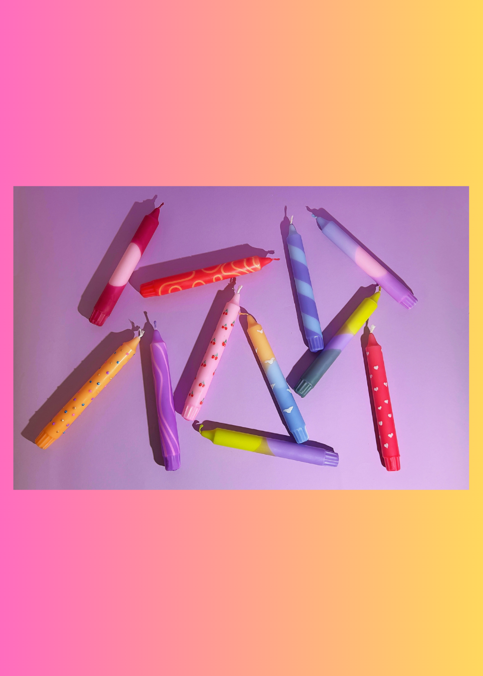 Colorful candles on a gradient background