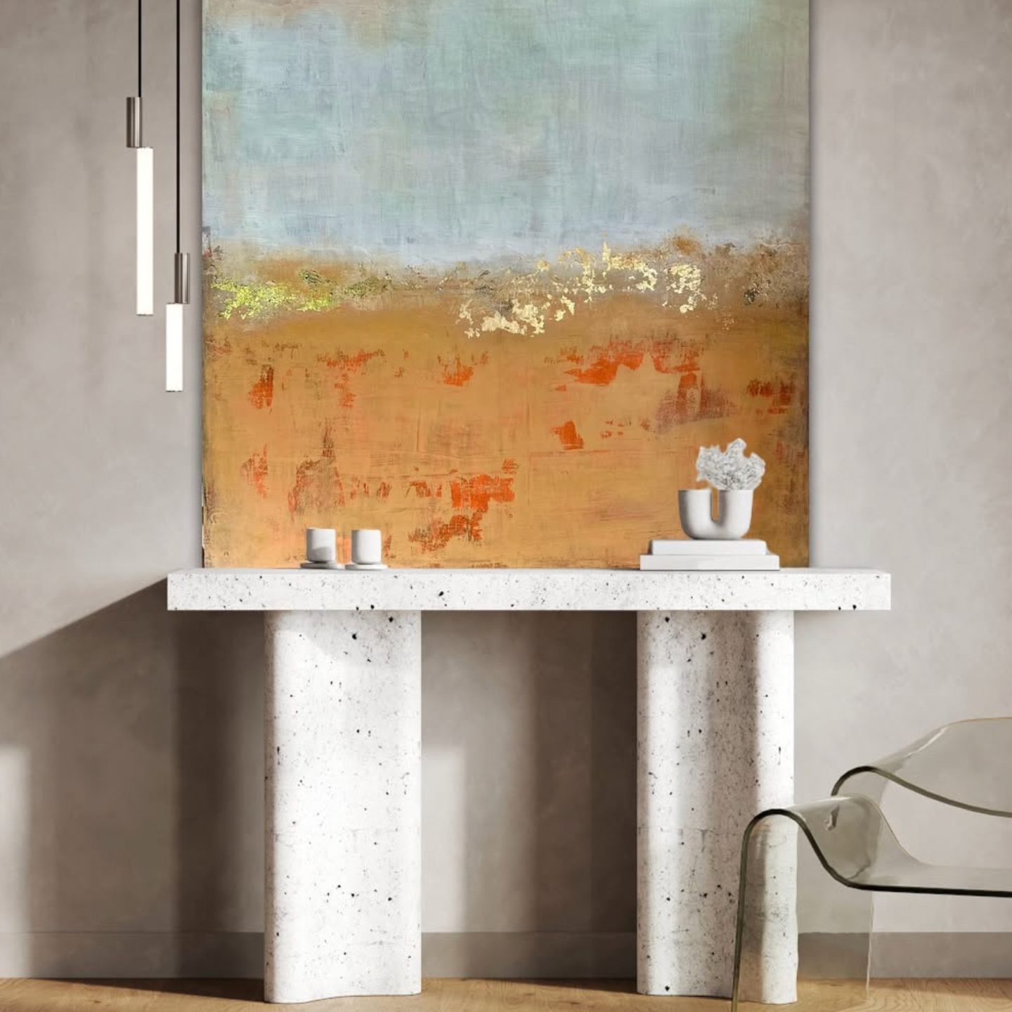 Abstract landscape painting on a modern console table with decorative items.