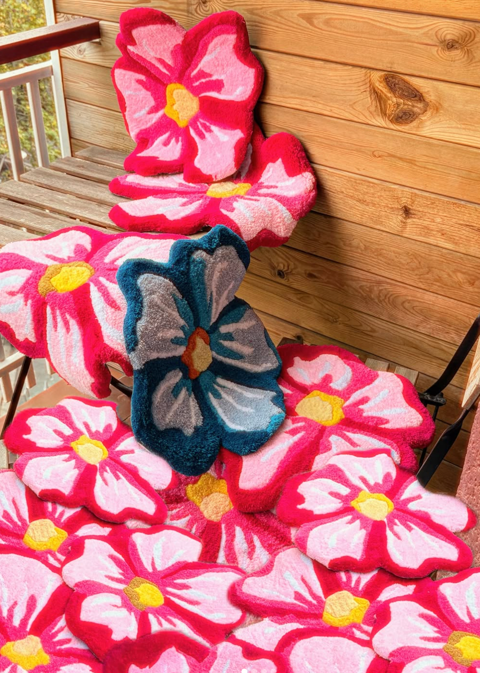 Floral-patterned cushions on a wooden deck