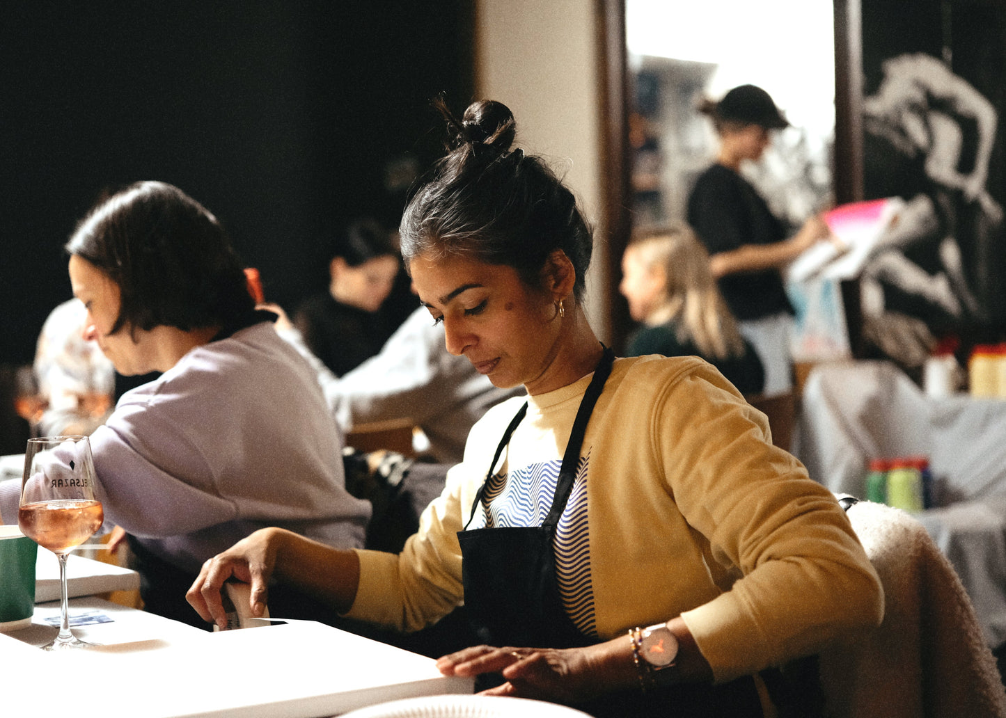 Woman in a restaurant setting preparing food