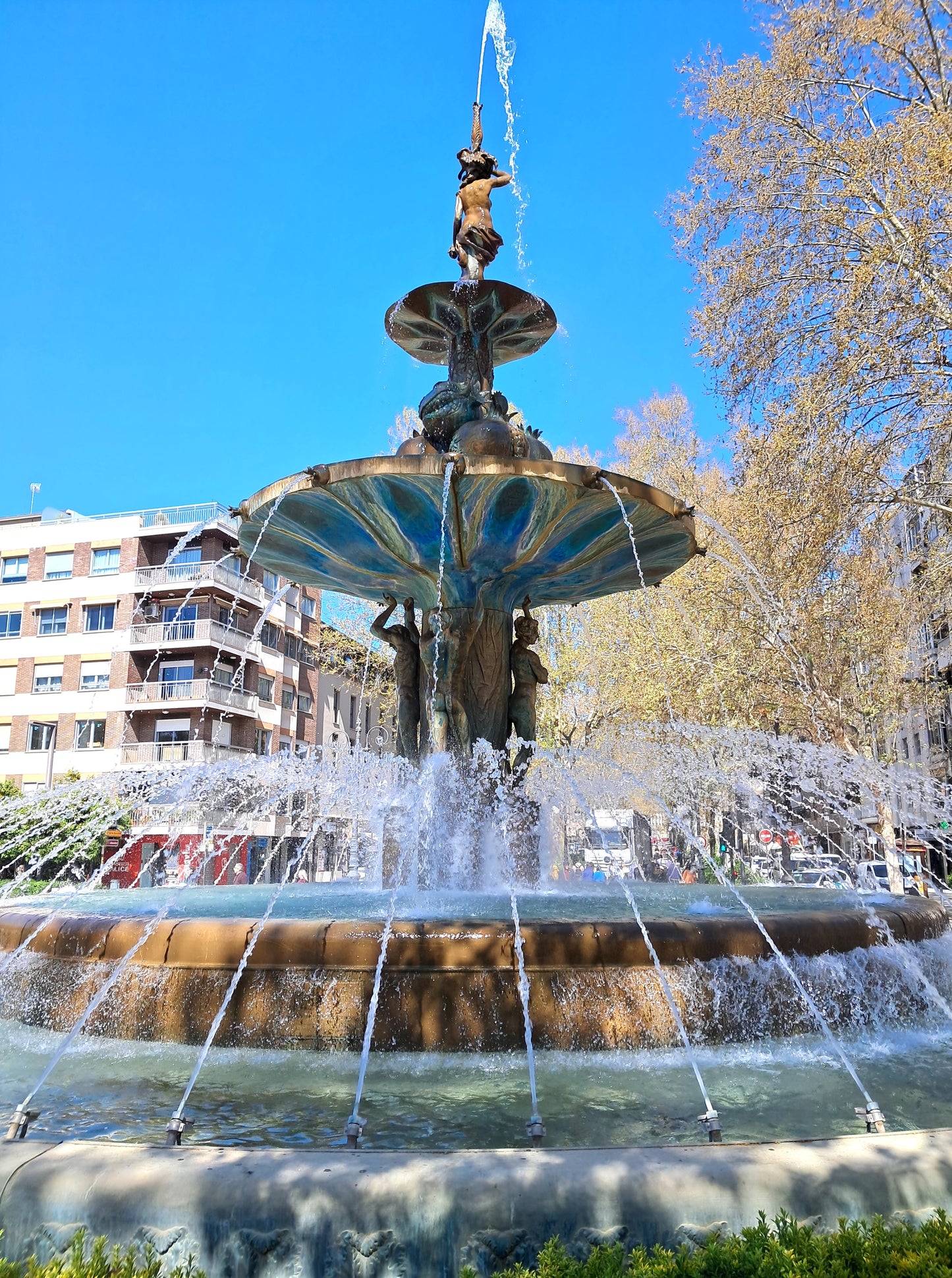 Fountain with water spouting in an urban setting