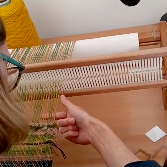 Woman weaving at the loom in Lisbon, Portugal
