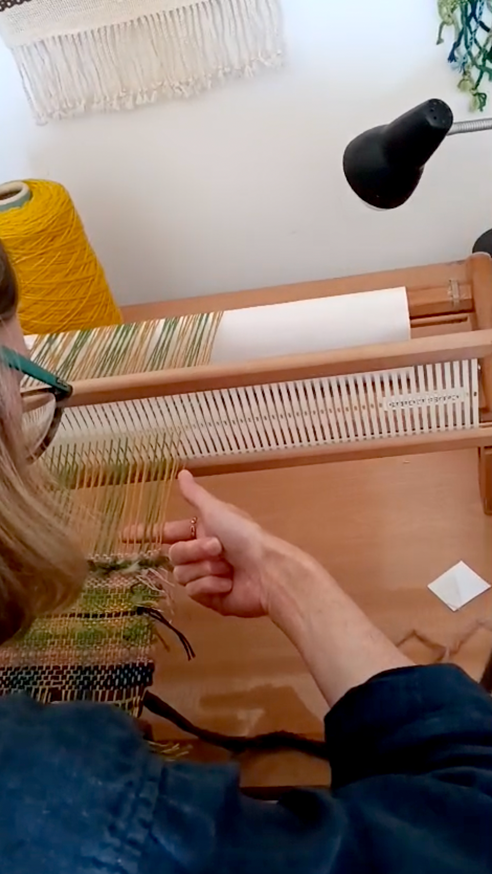 Woman weaving at the loom in Lisbon, Portugal